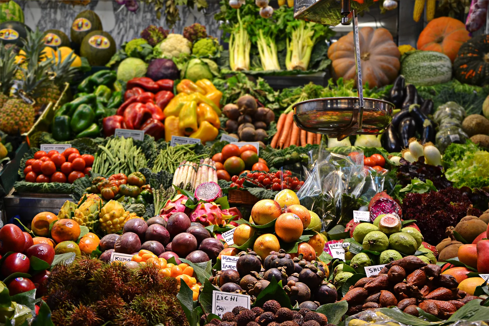 Fruit and vegetables piled high on a market stall